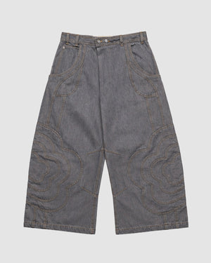 The JOONIVERSE JEANS GREY by Sundae School feature wide-leg gray denim, decorative curved stitching on both legs, a high waist, and large front pockets. Displayed flat on a plain white background.