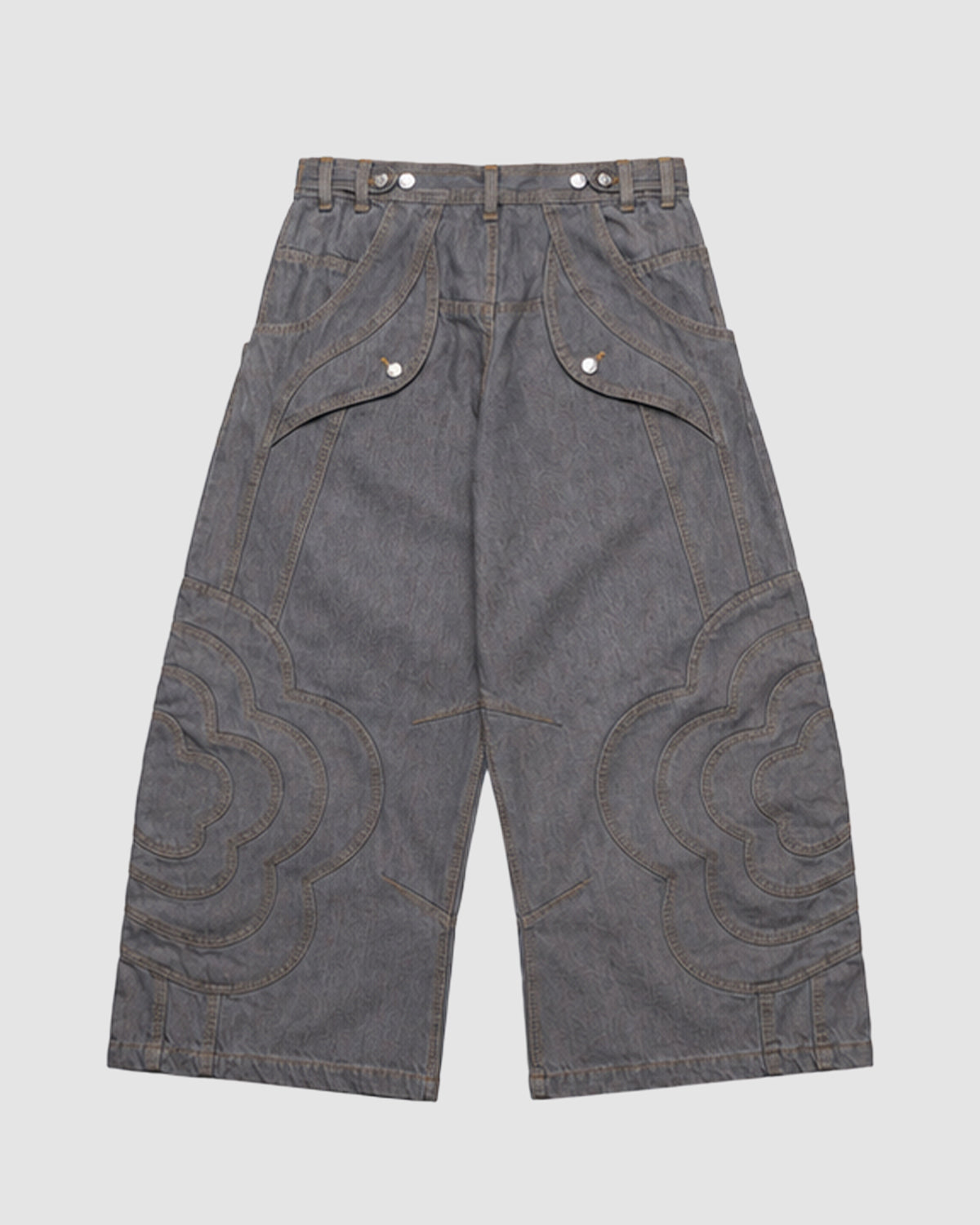 The JOONIVERSE JEANS GREY by Sundae School feature wide-leg gray denim, decorative curved stitching, unique seams, large patch pockets, button details, and belt loops for an avant-garde look.