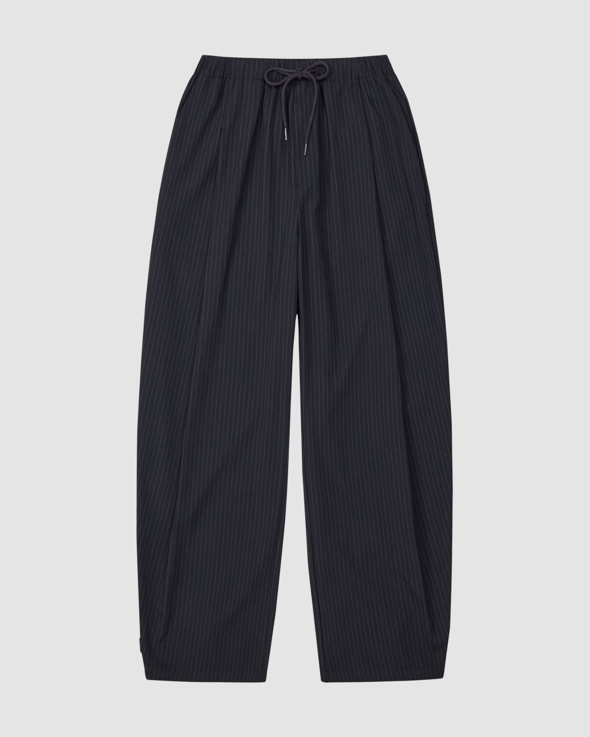 The Sundae School KIKI DRAWSTRING SLACKS are wide-leg, dark navy pinstripe sweatpants with a relaxed barrel leg and elastic drawstring waist, shown laid flat on a light gray background.