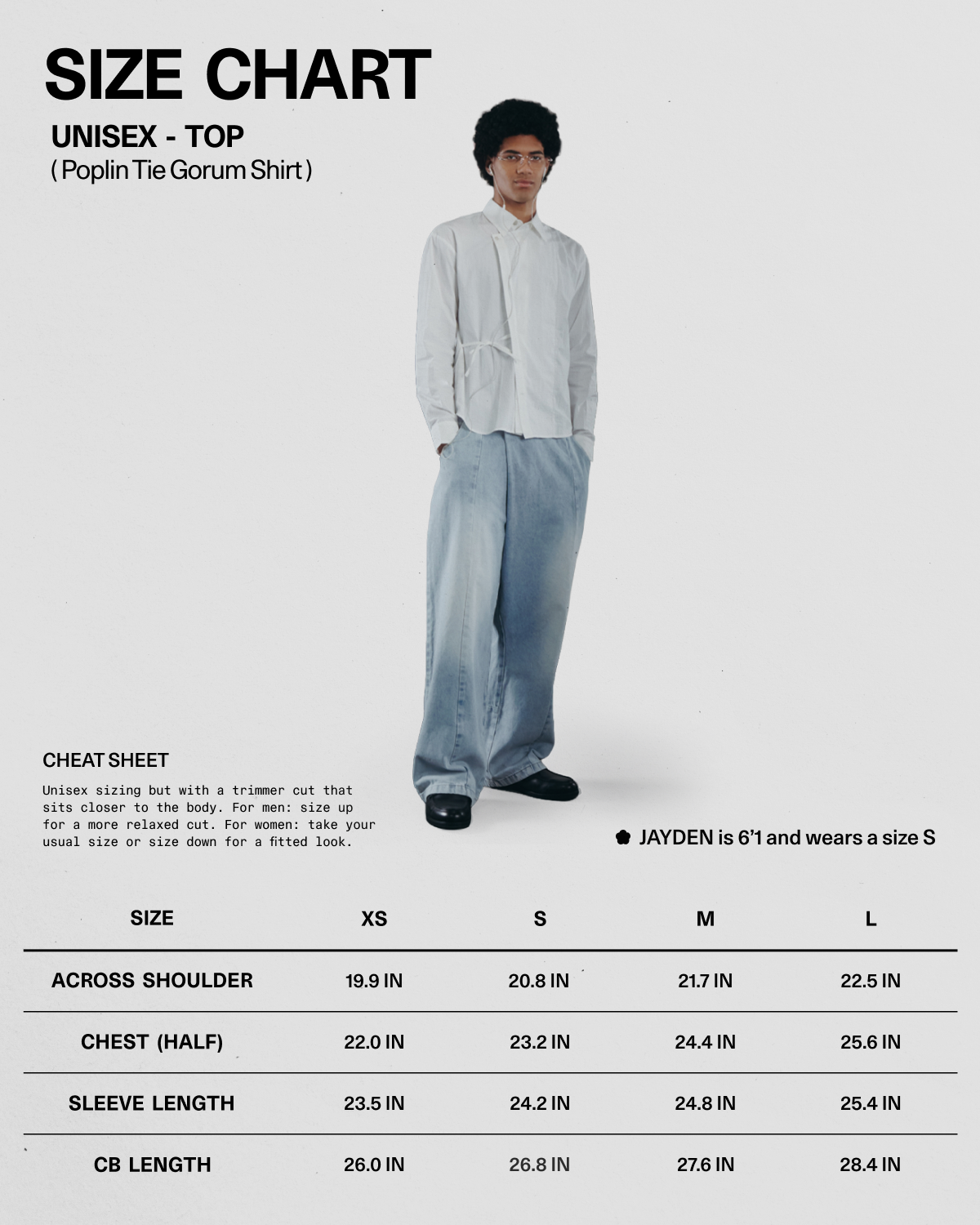 A person wearing the WHITE POPLIN TIE GORUM SHIRT by Sundae School and wide jeans stands beside a unisex size chart for the shirt, displaying XS–XL measurements. A note mentions that Jayden is 5'1