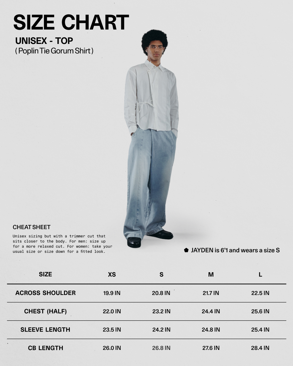 A person wearing the WHITE POPLIN TIE GORUM SHIRT by Sundae School and wide jeans stands beside a unisex size chart for the shirt, displaying XS–XL measurements. A note mentions that Jayden is 5'1" and wears a size S.