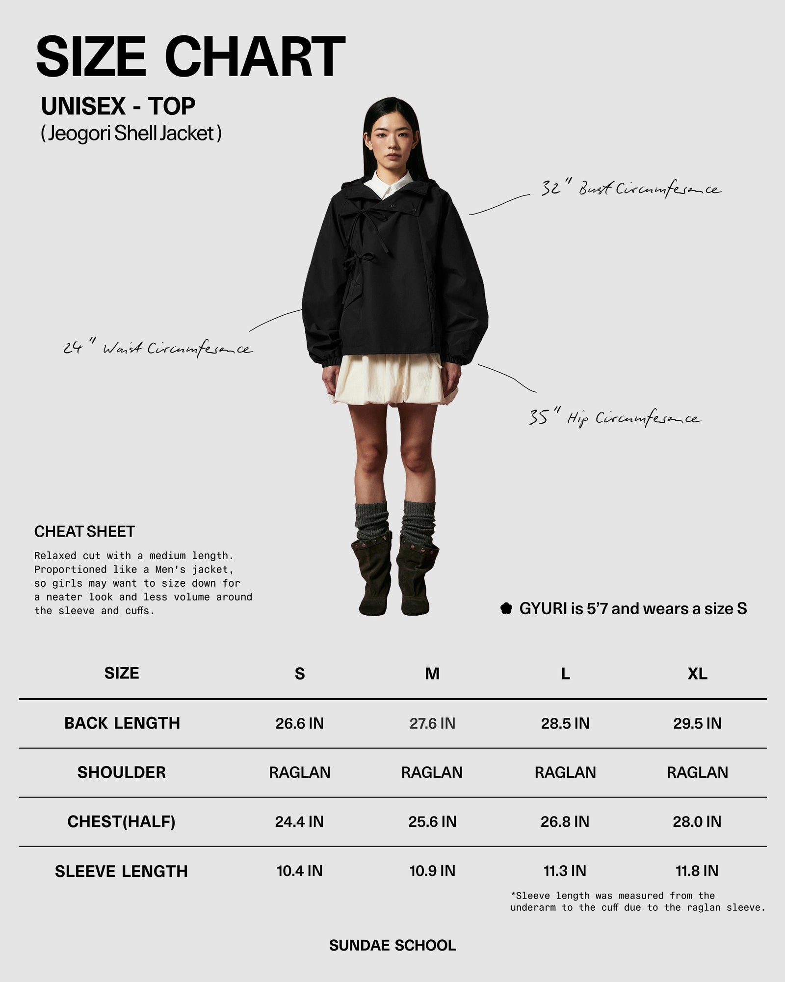 A female model wears the BLACK JEOGORI TIE SHELL JACKET by Sundae School, paired with a cream skirt, while standing in front of a size chart displaying unisex top measurements from S to XL. Handwritten measurement lines are marked on the model, highlighting this water-resistant outerwear as standout unisex technical apparel.