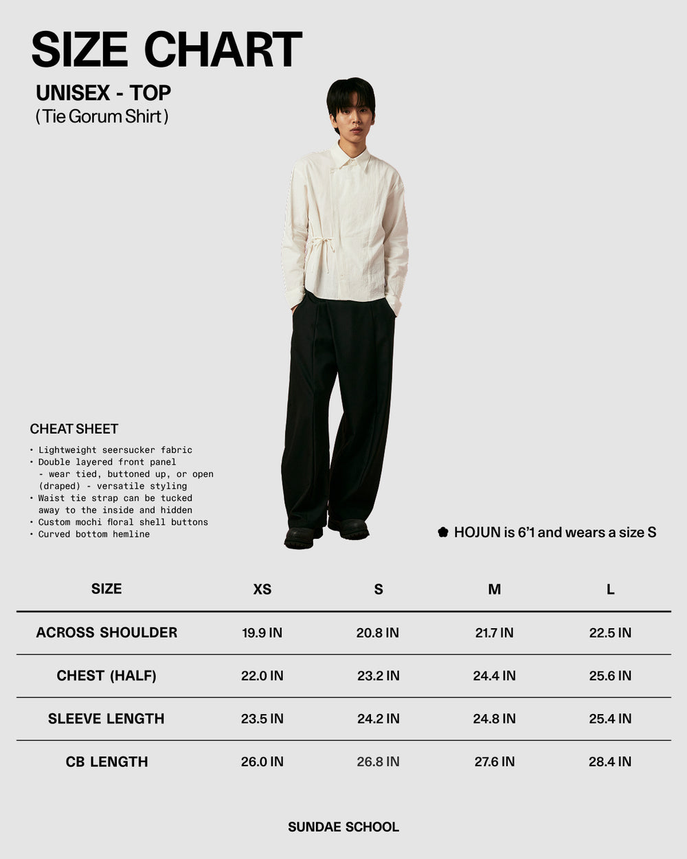 Size chart for a unisex top with a model wearing it, featuring measurements in inches.