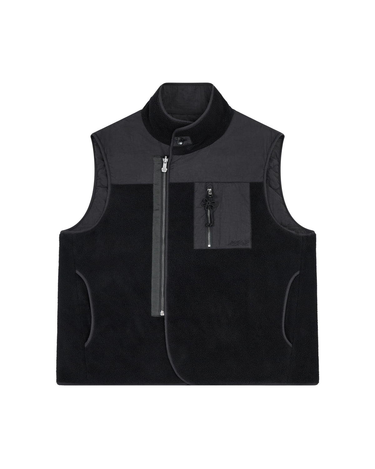 The BLACK MOMO REVERSIBLE FLEECE VEST by Sundae School is a sleeveless, black fleece vest featuring a high collar, asymmetrical front zipper, zippered chest pocket, and side pockets. The vest is displayed flat on a white background.