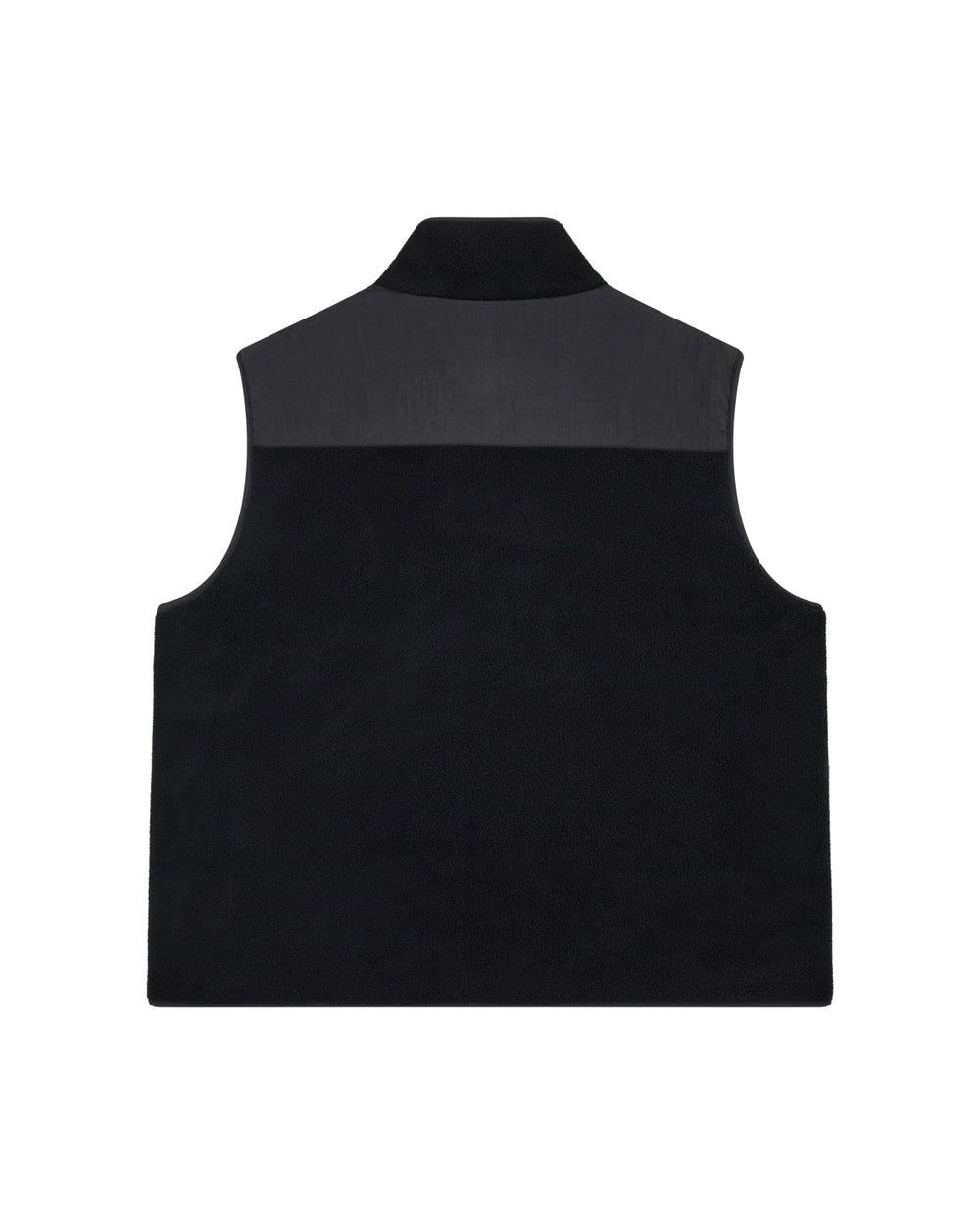 The BLACK MOMO REVERSIBLE FLEECE VEST by Sundae School is a black, sleeveless vest with a high collar and a contrasting darker panel across the shoulders. It is displayed flat, photographed from the back against a white background.