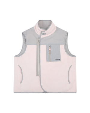 The BABY PINK MOMO REVERSIBLE FLEECE VEST by Sundae School features a light pink and gray colorway, high collar, sleeveless design, asymmetrical zip closure, zippered chest pocket, two side pockets, and subtle stitching details.
