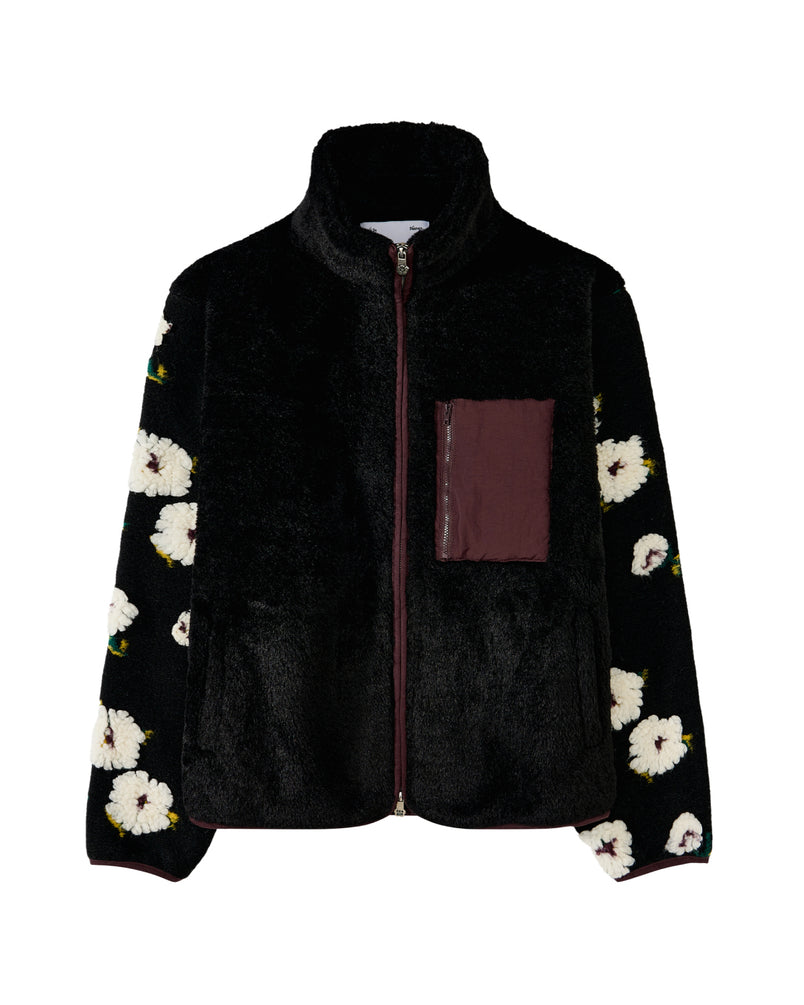 The MUGUNGHWA FLEECE by Sundae School is a black zip-up sherpa fleece jacket adorned with white floral motifs inspired by the Korean national flower on the sleeves, and features a maroon chest pocket on the left side.