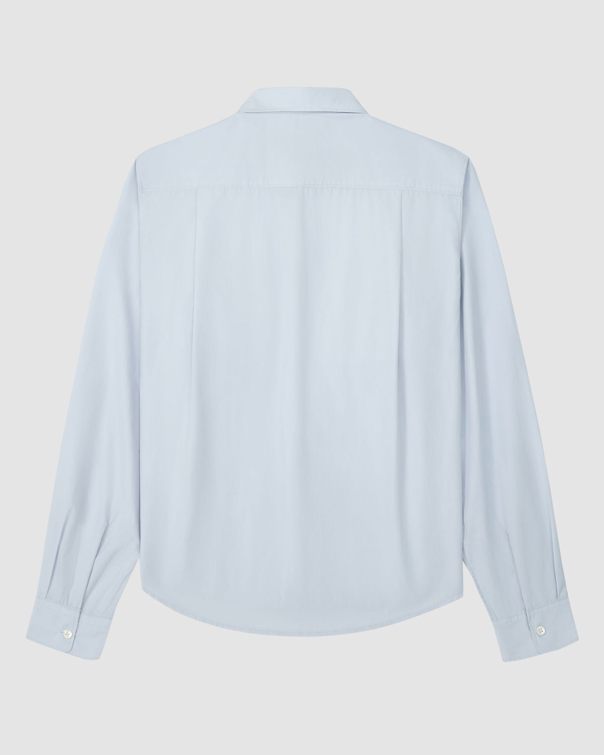 The Sundae School NECKTIE SHIRT is a light blue, long-sleeved relaxed shirt with a collar and buttoned cuffs, shown from the back and laid flat on a white background.