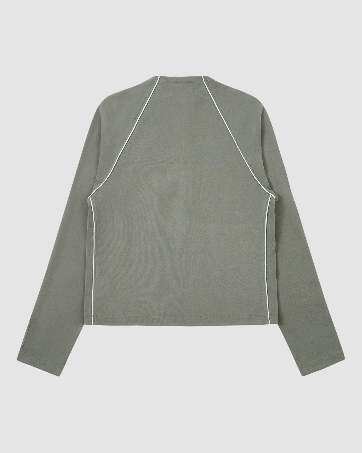 The Sundae School Khaki Office Quarter Zip is a long-sleeve sage green top with white seam piping and a subtle stash pocket, shown flat against a light gray background.