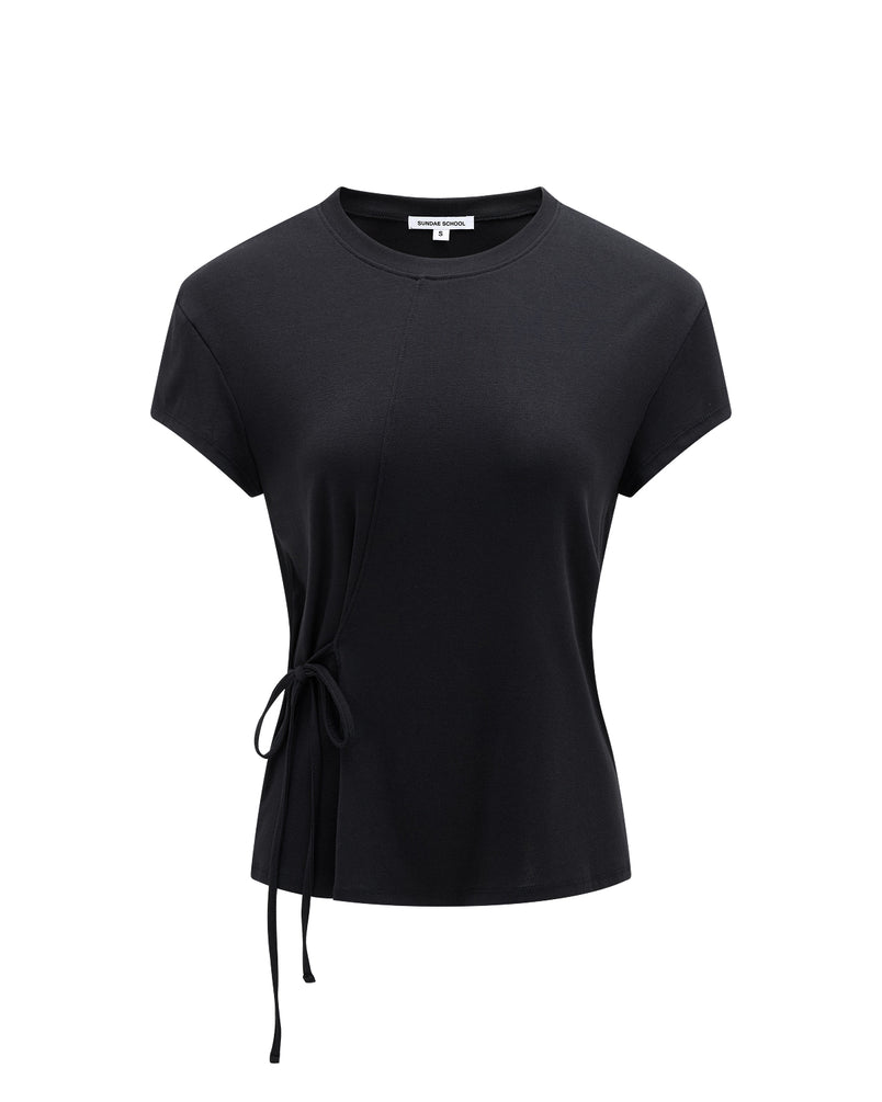 The BLACK ORIGAMI GORUM TEE by Sundae School is a women’s black short-sleeve t-shirt with a round neckline, an asymmetrical seam, and a side tie detail on the left waist, shown against a plain white background.