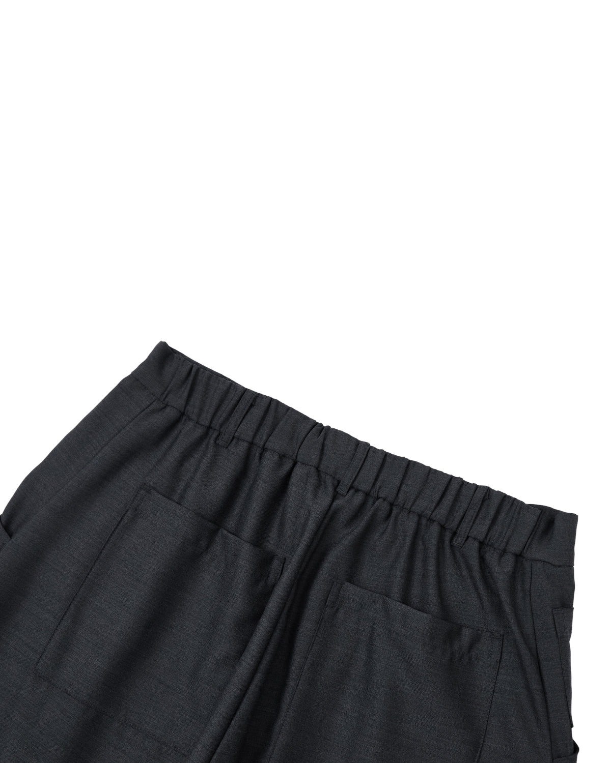 Close-up of the waist and upper section of Sundae School’s CHARCOAL PLEATED HANBOK SLACKS, featuring an elastic waistband and two large front pockets, displayed on a white background.