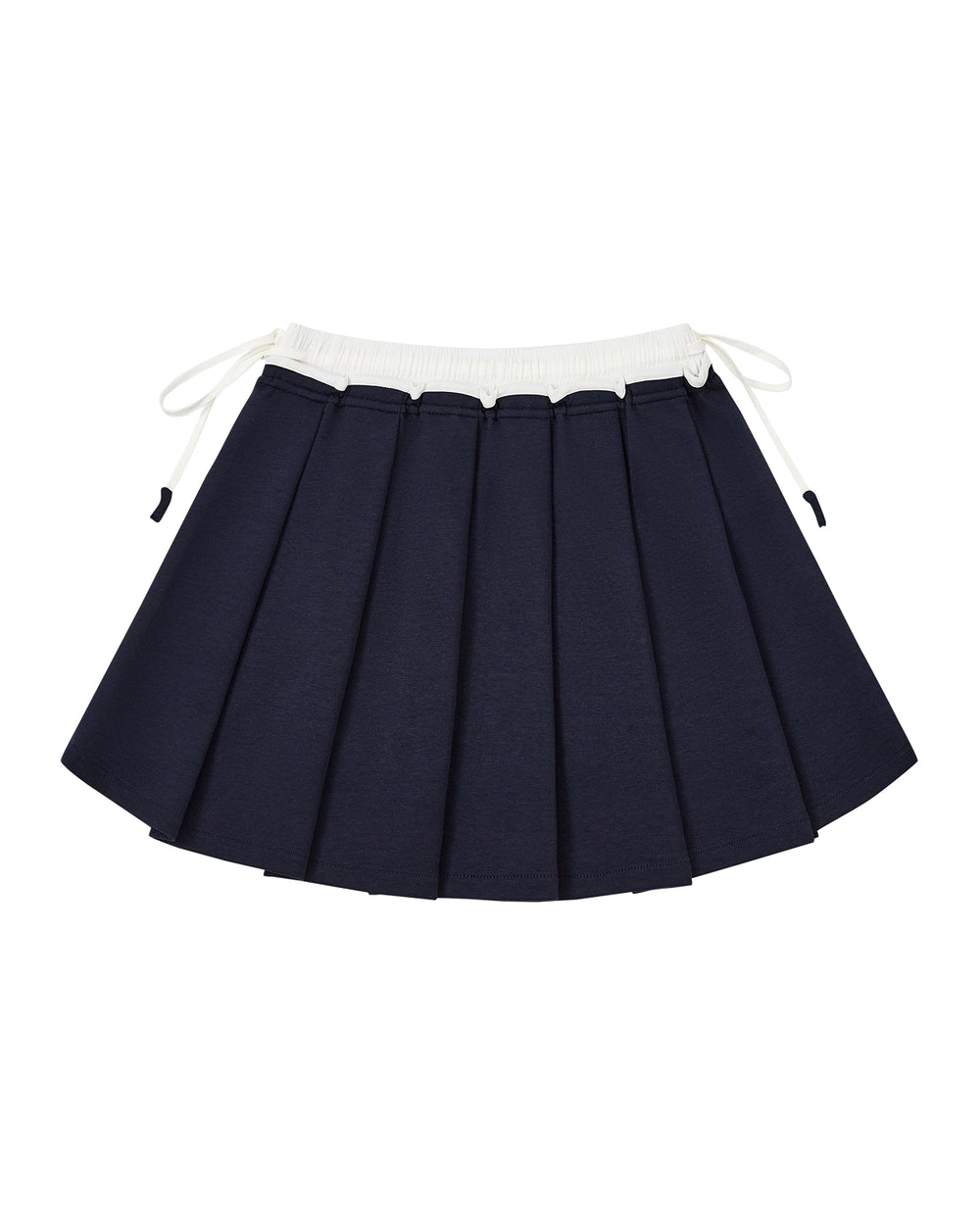 The NAVY PLEATED JERSEY MINI SKIRT by Sundae School, featuring a navy blue knife-pleated design with a contrasting white waistband and side drawstrings, is crafted from a soft cotton blend jersey and displayed flat on a white background.