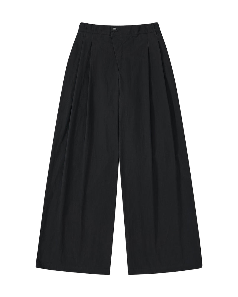 Sundae School's BLACK PLEATED UNIFORM SLACKS are unisex, high-waisted, with a wide-leg fit, front pleats, and button-zipper closure, inspired by Korean school uniforms and shown on a plain white background.