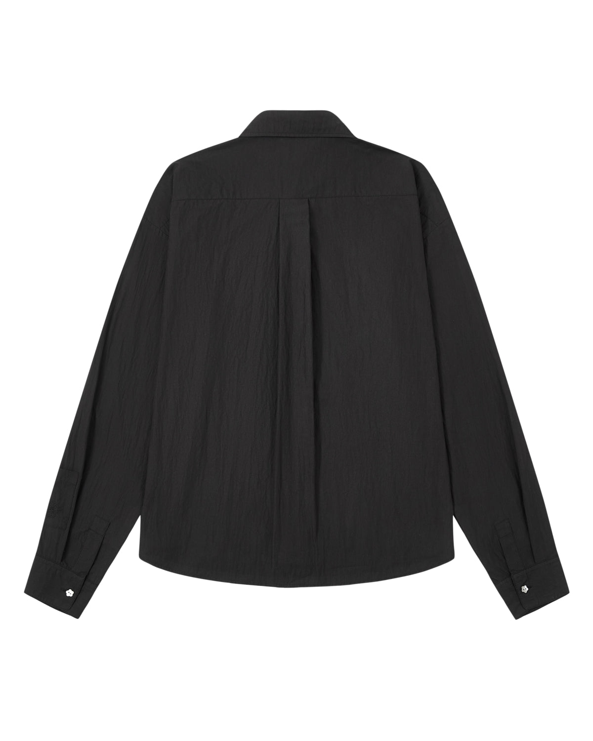 The BLACK POPLIN TIE GORUM SHIRT by Sundae School is displayed from the back, showcasing a central pleat and buttoned cuffs. Made from a slightly textured cotton-nylon blend in a poplin weave, this unisex shirt offers a tailored fit.