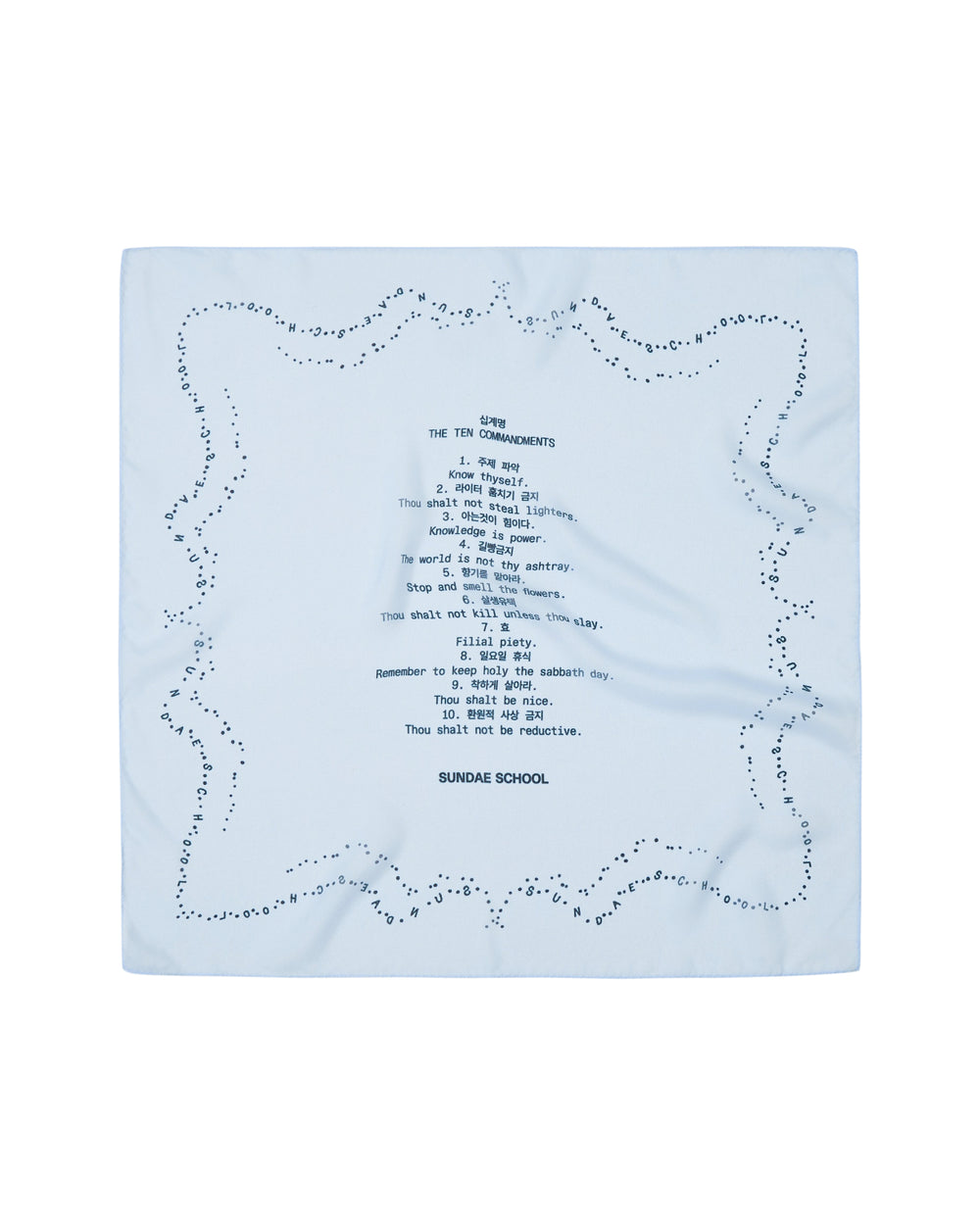 A sheer sky blue organza bandana from Sundae School features decorative dots along the edge and showcases printed text in a sundae-shaped arrangement at the center, including “THE TEN COMMANDMENTS” and “SUNDAE SCHOOL TEN COMMANDMENTS,” among other phrases.
