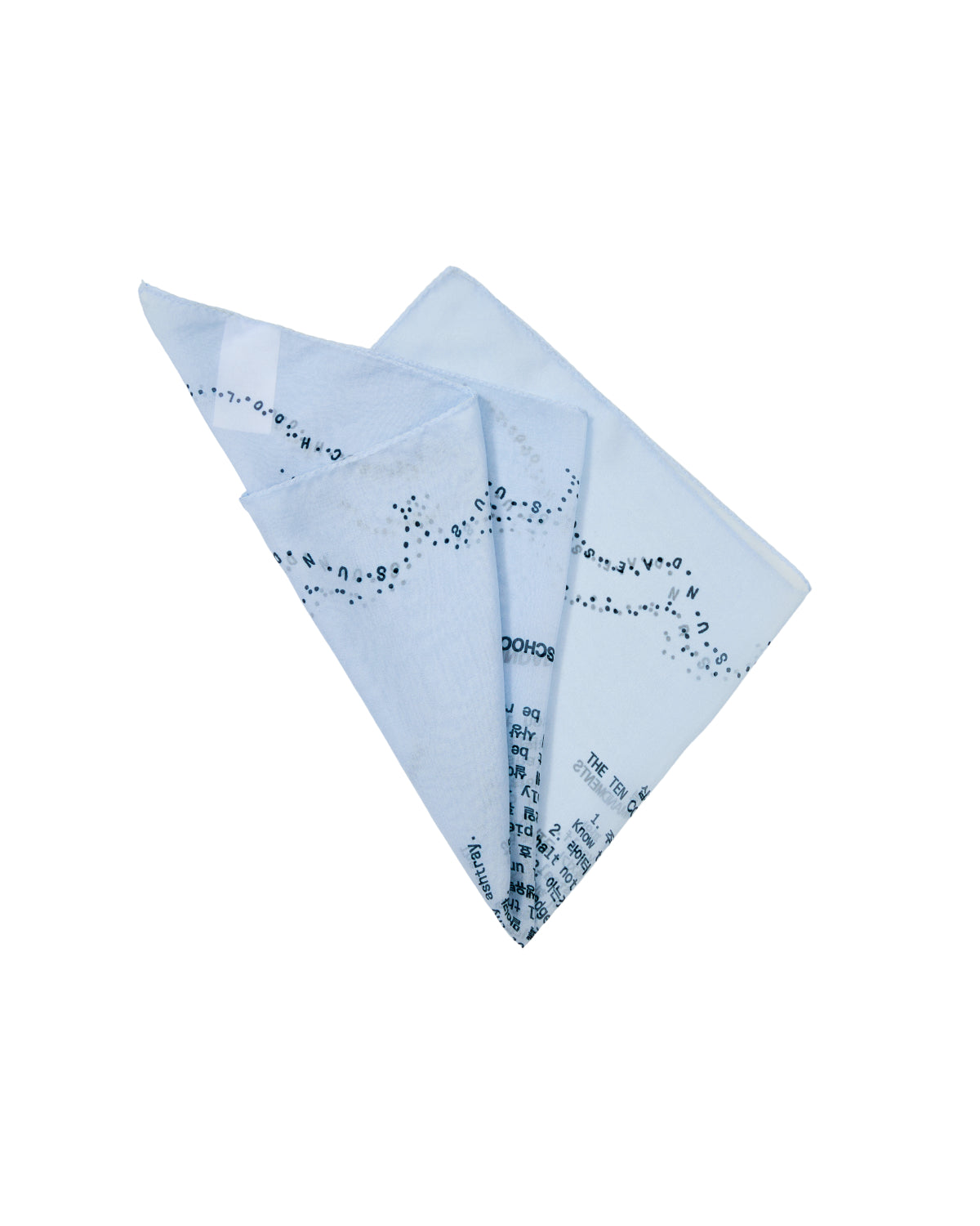 A SKY BLUE 10 COMMANDMENTS ORGANZA BANDANA by Sundae School, neatly folded and displayed against a plain white background, features scattered black text and dotted patterns printed across its sheer light blue fabric—evoking the elegance of a silk scarf.