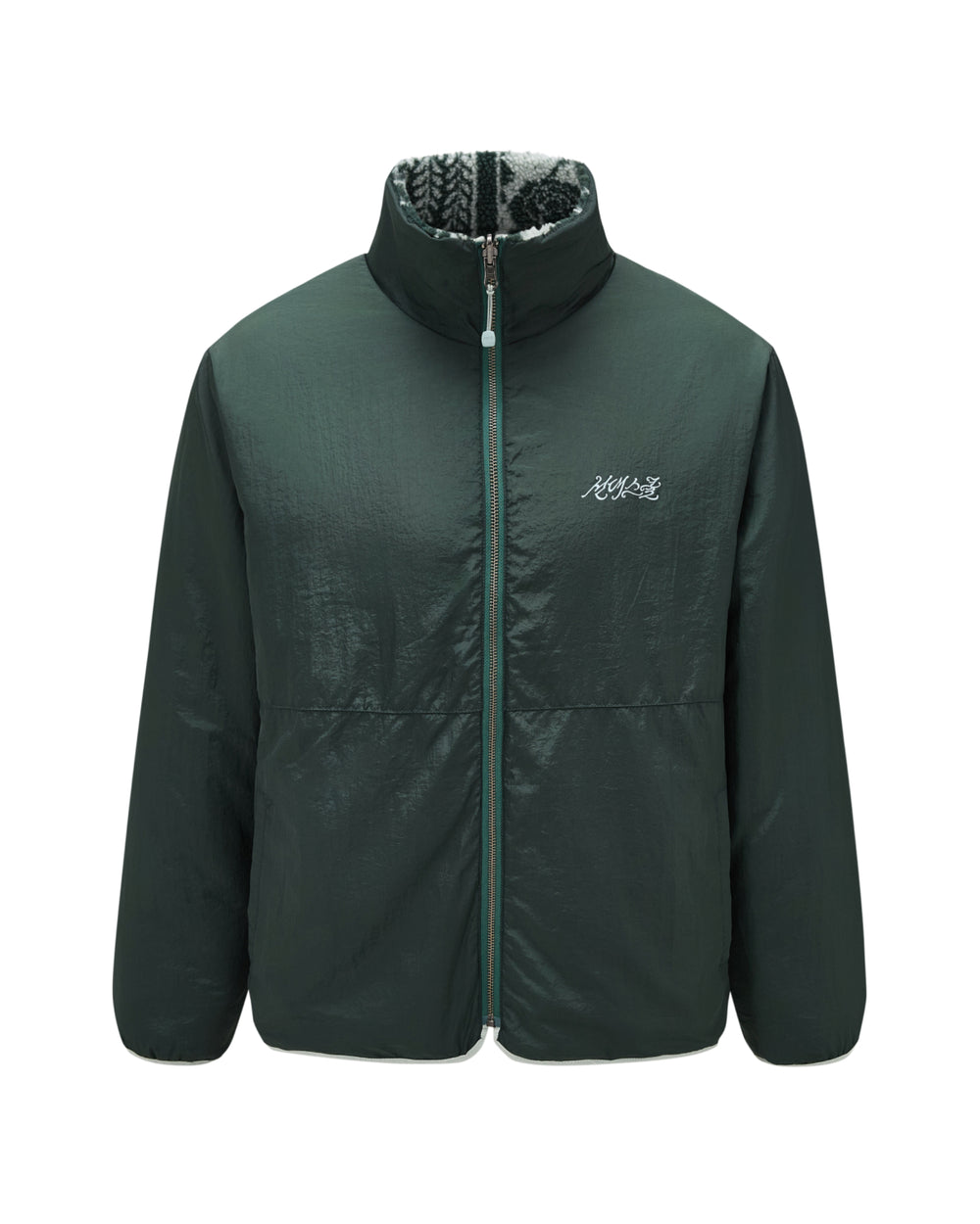 The TEAL REVERSIBLE GOSTOP FLEECE by Sundae School features a dark green hue with a stand collar, zip-up front, and a white logo on the left chest, showcased against a plain white background. Its inner lining displays a striking black and white patterned design, enhancing the style of this reversible sherpa fleece puffer.