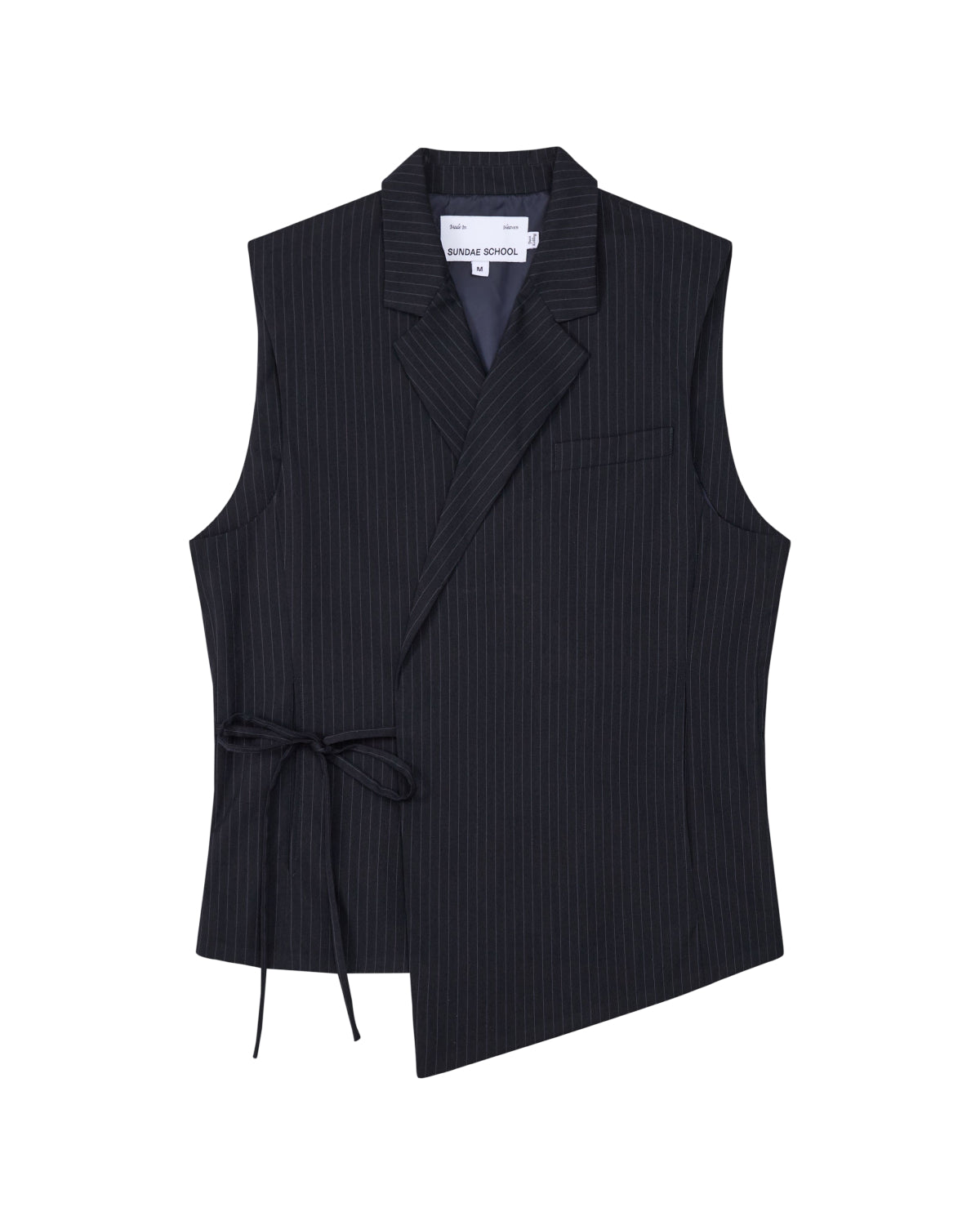 The SABRINA VEST by Sundae School is a sleeveless black pinstripe rayon blend vest featuring an asymmetric hem, side Korean goreum tie, lapel collar, and a single chest pocket, shown on a white background.