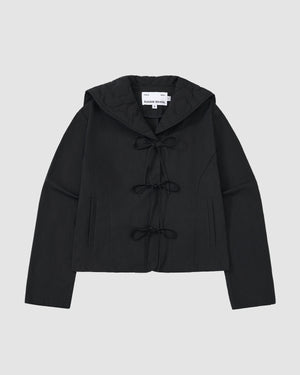 The BLACK SAILOR COLLAR UNIFORM JACKET by Sundae School is a black hooded jacket with mochi quilted stitching, three bow tie closures, and two vertical slit pockets. The inside collar features a visible label.