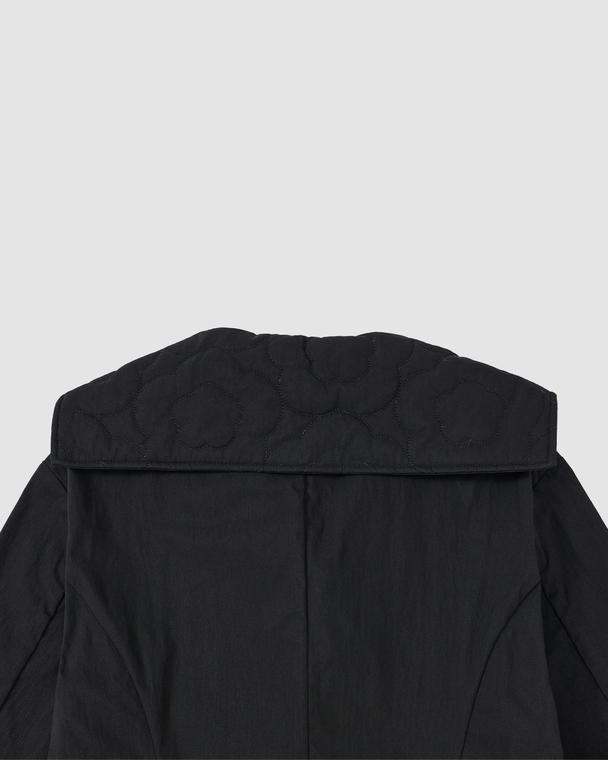 Back view of the Sundae School BLACK SAILOR COLLAR UNIFORM JACKET, showcasing mochi quilted stitching and a wide sailor collar, displayed on a plain light gray background.