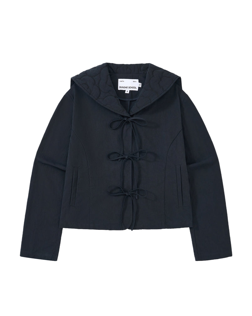 The NAVY SAILOR COLLAR UNIFORM JACKET by Sundae School is a black jacket featuring a quilted hood, long sleeves, two front pockets, and three bow tie closures down the front. Its design showcases floral quilted stitching inspired by classic Korean school uniform style.