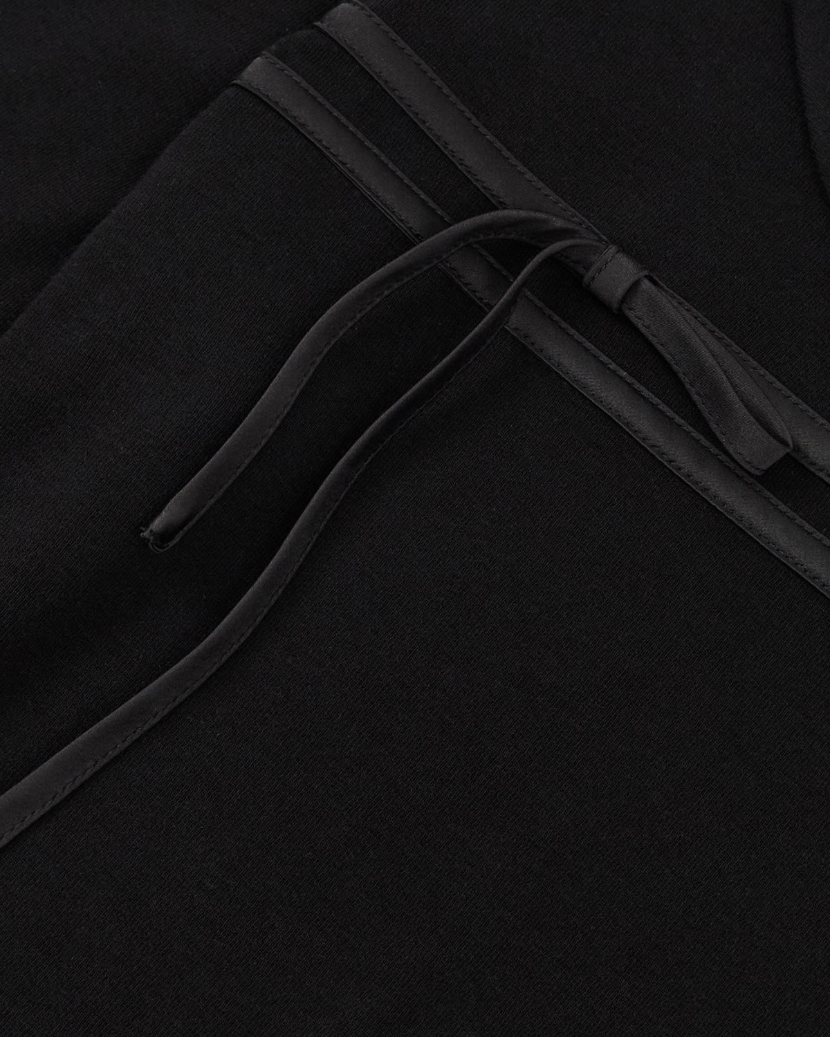 BLACK SEONGSU KEYHOLE TOP: black long-sleeved blouse with a rounded collar and a keyhole neckline featuring satin ties.