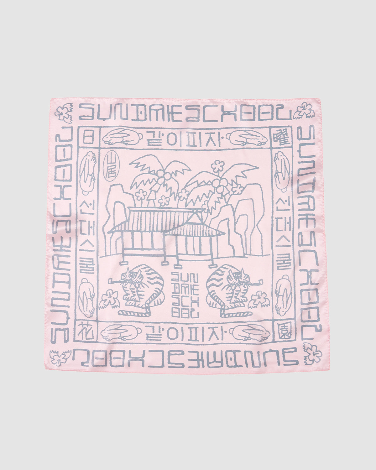 The PINK SILK BANDANA by Sundae School features soft pink silk with gray pavilion, tree, and cloud motifs at the center, bordered by stylized text and Hunminjeongeum script—a unique Korean heritage accessory.