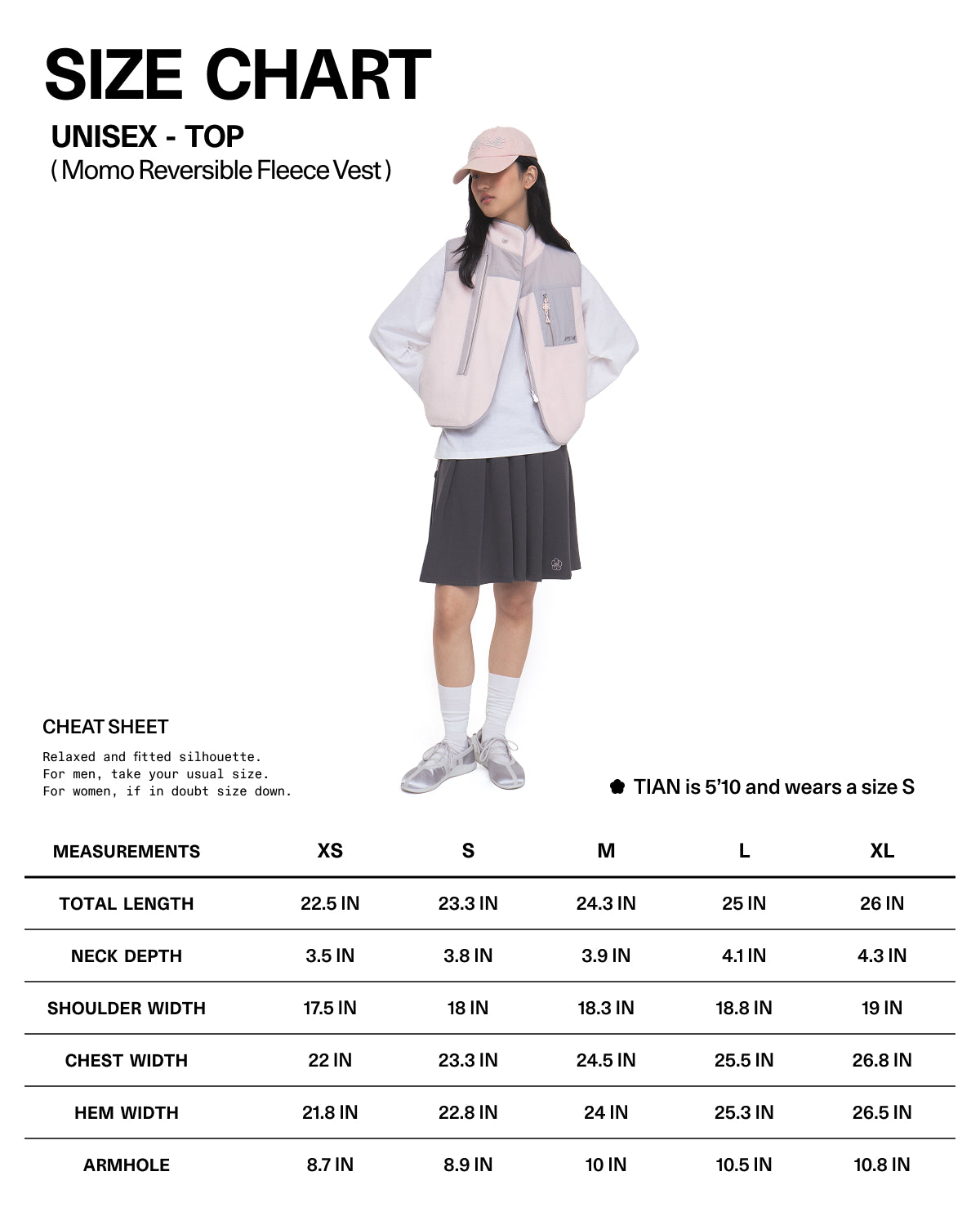 A person wearing the Sundae School BABY PINK MOMO REVERSIBLE FLEECE VEST over a gray top and gray skirt, paired with a cap and sneakers, stands in front of a white background featuring a size chart for the vest.
