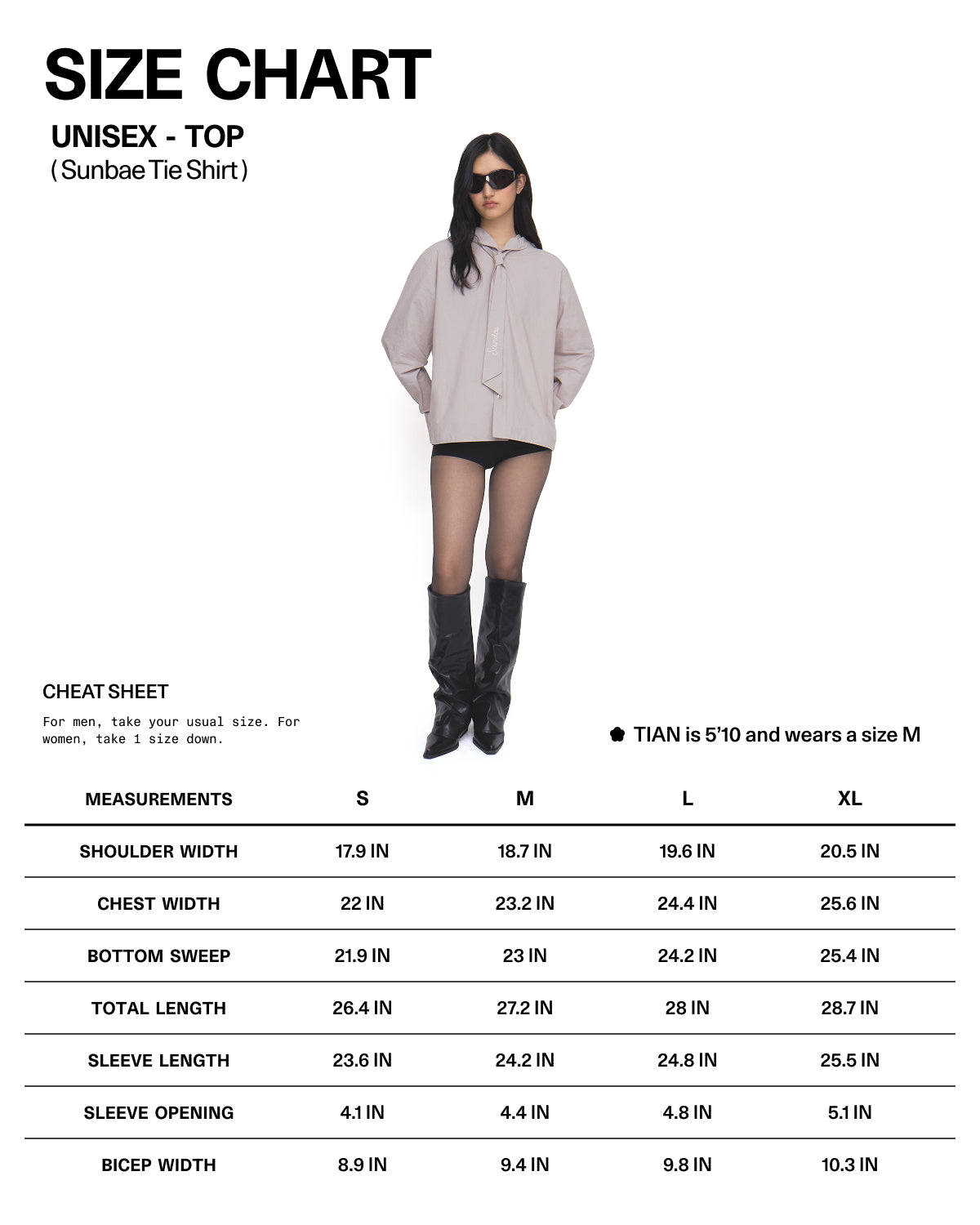A woman wearing sunglasses, a beige oversized shirt, black shorts, sheer tights, and boots stands next to a unisex size chart for the GREY SUNBAE TIE SHIRT by Sundae School with measurements for S, M, L, and XL.