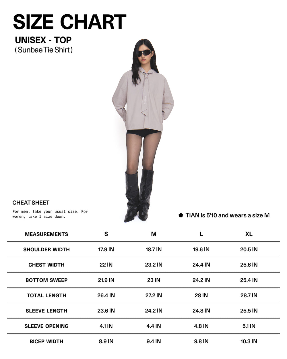 A woman wearing sunglasses, a beige oversized shirt, black shorts, sheer tights, and boots stands next to a unisex size chart for the GREY SUNBAE TIE SHIRT by Sundae School with measurements for S, M, L, and XL.