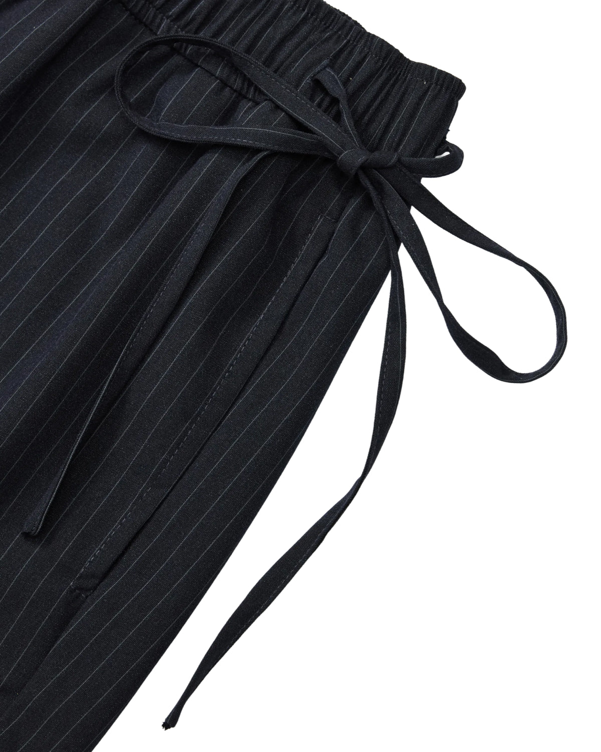 Close-up of Sundae School STRIPED BOXER SHORTS in black pinstripes, crafted from a lightweight rayon blend with an elastic waistband and a tied fabric belt.