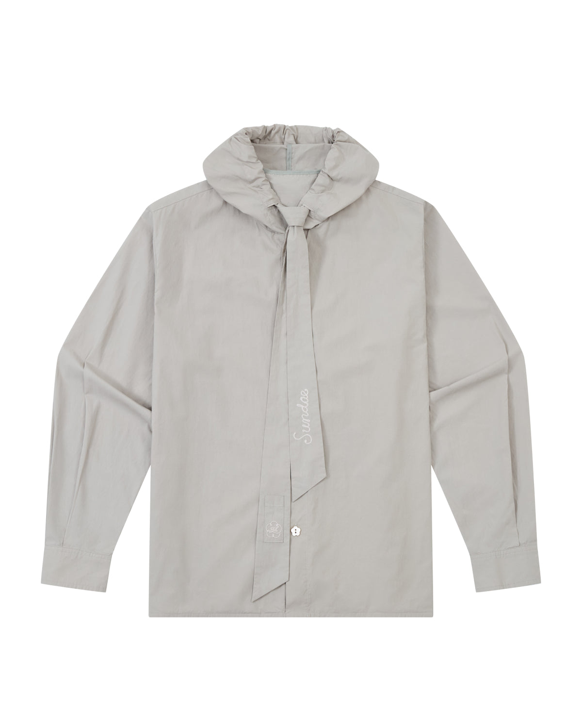 The GREY SUNBAE TIE SHIRT by Sundae School is a light gray, long-sleeve button-up featuring a wide, tied scarf collar with embroidered text. The shirt is displayed flat, showcasing its front details and button closures.
