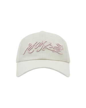 Introducing the IVORY DAENGGI CAP by Sundae School: an adjustable cotton cap in a cream shade, featuring a curved brim and pink embroidered script on the front—an elegant nod to Korean logo hat design.