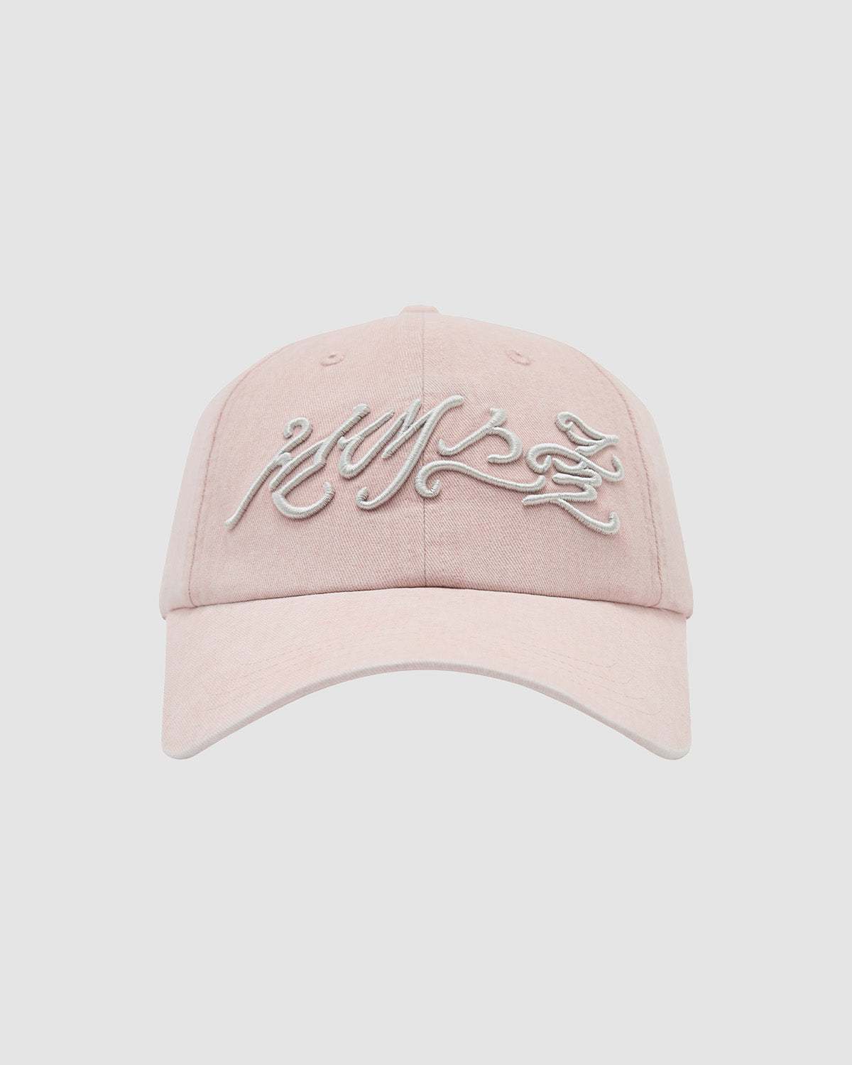 The BABY PINK DAENGGI CAP by Sundae School is a light pink adjustable cotton cap with white embroidered script on the front, shown against a light gray background—perfect for adding a trendy touch to any casual outfit.