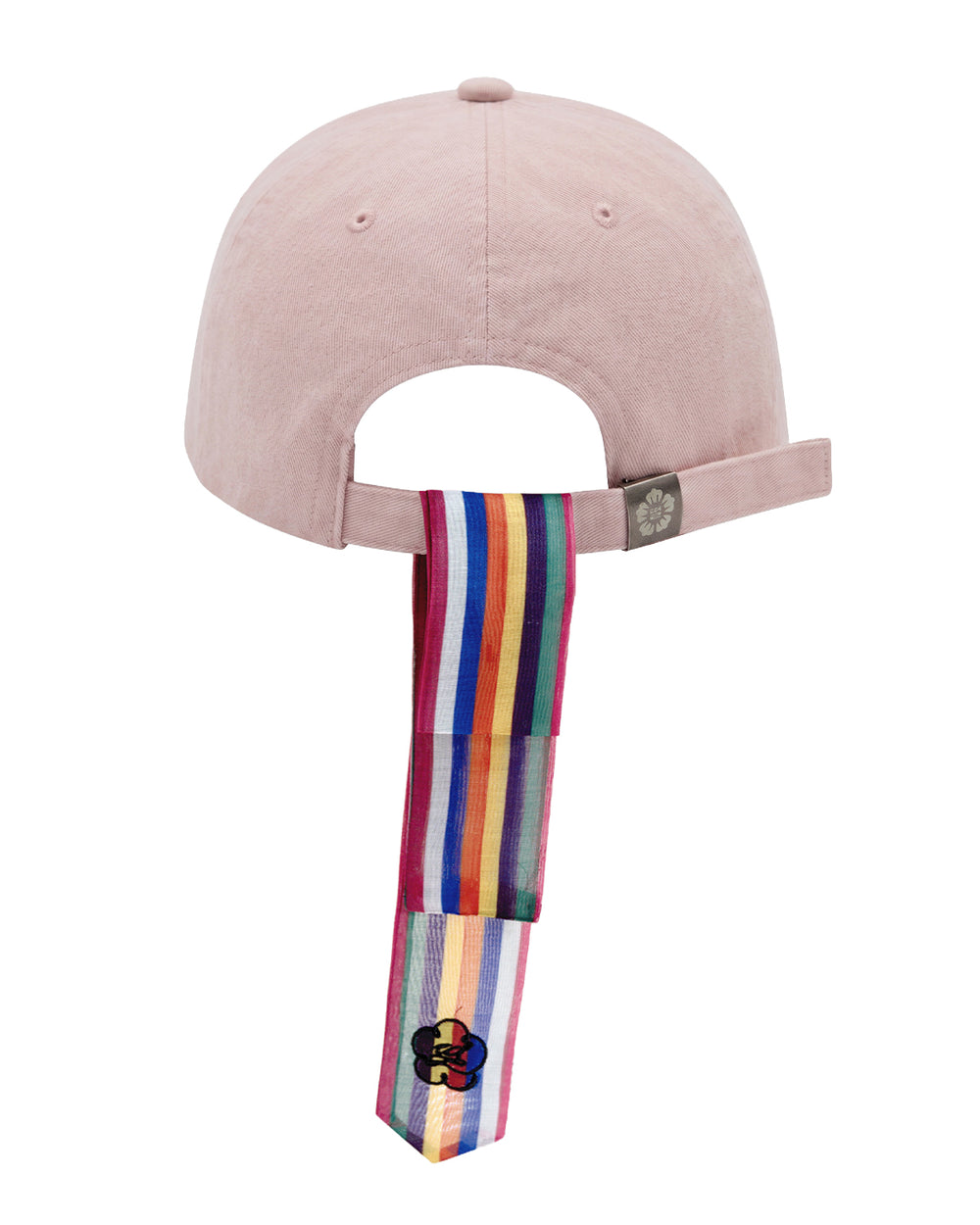 A BABY PINK DAENGGI CAP by Sundae School, crafted from cotton and shown from the back, features an adjustable strap adorned with a multicolored striped ribbon and a black flower motif—capturing the brand’s signature playful design details.