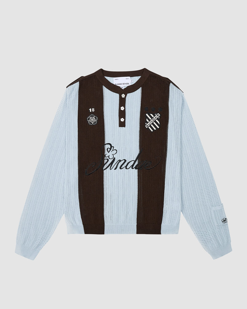 The SKY BLUE SUNDAE SOCCER JERSEY by Sundae School is a long-sleeve cotton knit polo with light blue and dark brown stripes, black collar and buttons, and embroidered B crest, 18, skull, and "Sunda" script on the chest.