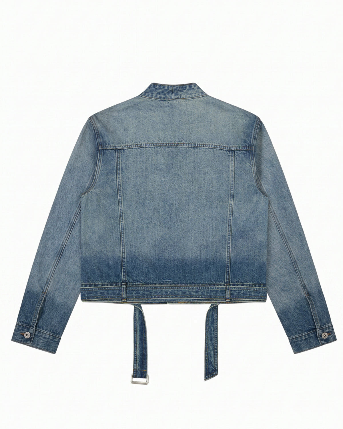 The MEDIUM BLUE TAEKWONDO DENIM JACKET by Sundae School is shown from the back in a faded blue wash, featuring long sleeves with buttoned cuffs and two denim straps hanging from the bottom hem for a modern Korean Canadian tuxedo vibe.
