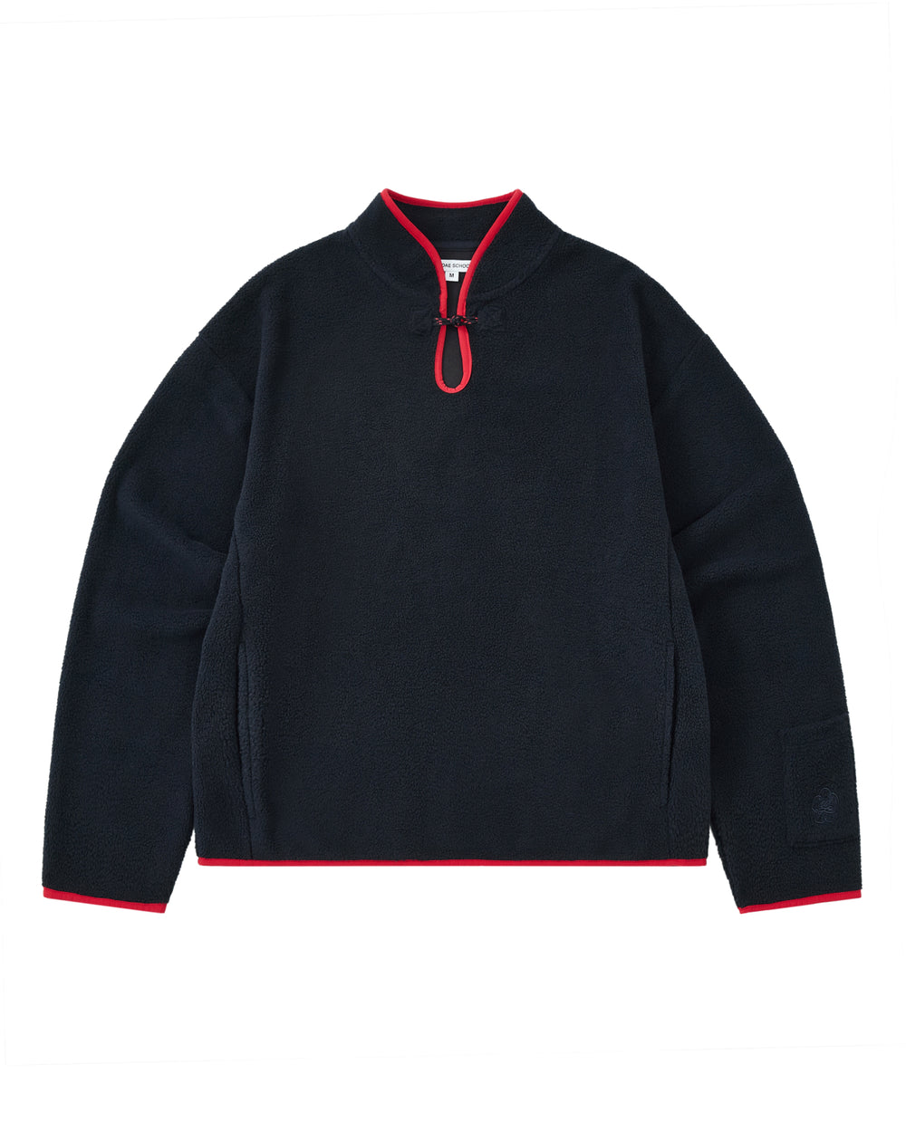 A cozy navy fleece pullover named the NAVY TEARDROP KNOT FLEECE by Sundae School, featuring a short zipper, red trim on the collar, cuffs, and hem, and long sleeves. This East Asian inspired garment is displayed laid flat on a white background.