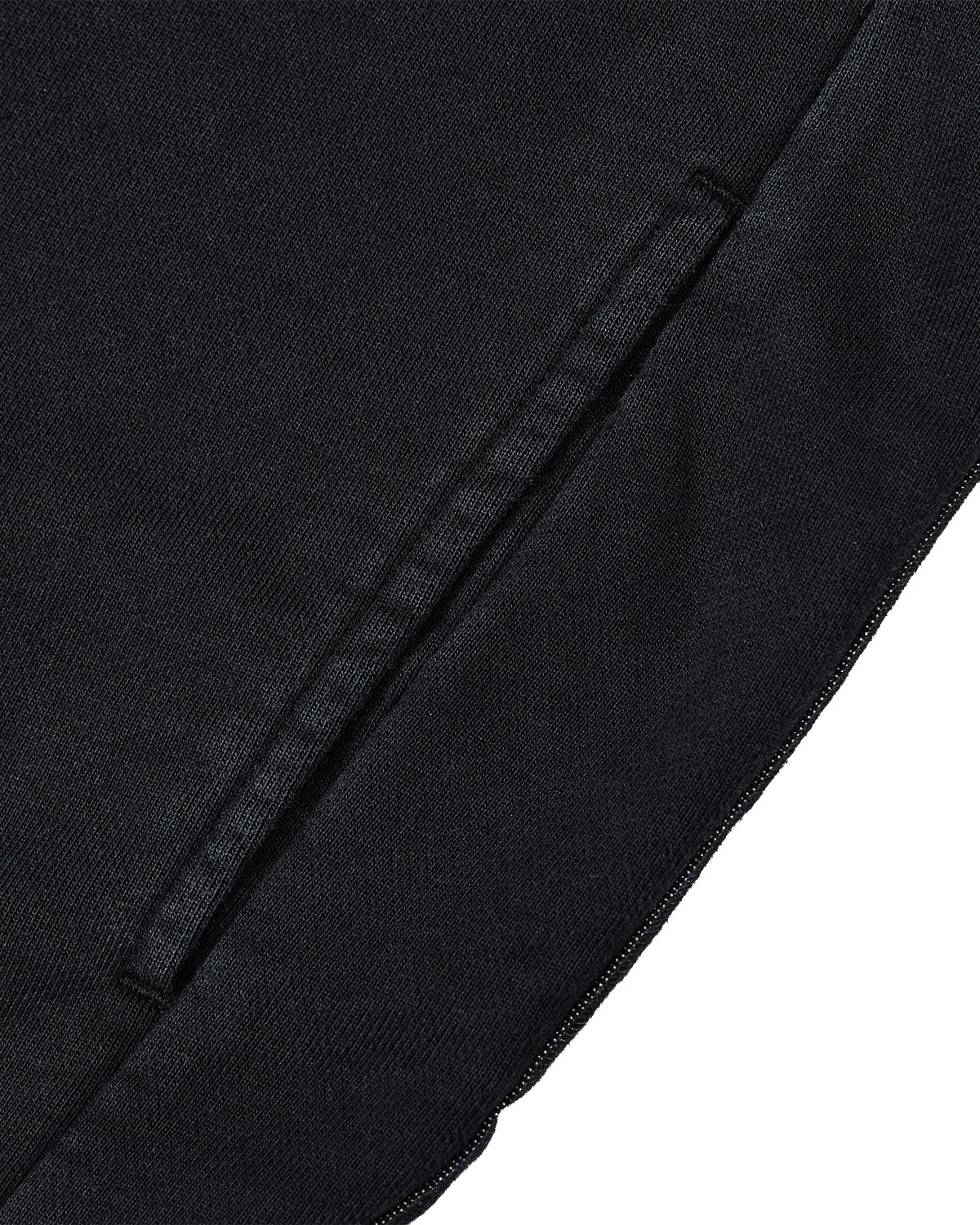 Close-up of the BLACK TEARDROP KNOT SWEATSHIRT by Sundae School, crafted from 100% cotton, featuring a side pocket with a visible seam and detailed stitching.