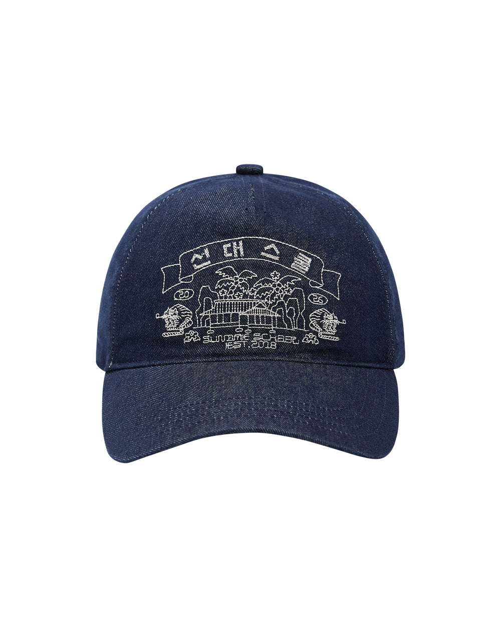 Introducing the TIGER DEN CAP by Sundae School—a navy blue baseball cap crafted from a premium cotton blend for exceptional comfort. This denim strapback hat features intricate white embroidery on the front, depicting buildings, trees, and a banner with stylized text inspired by traditional Korean folk-art. Add a unique cultural accent to any outfit with this standout piece.