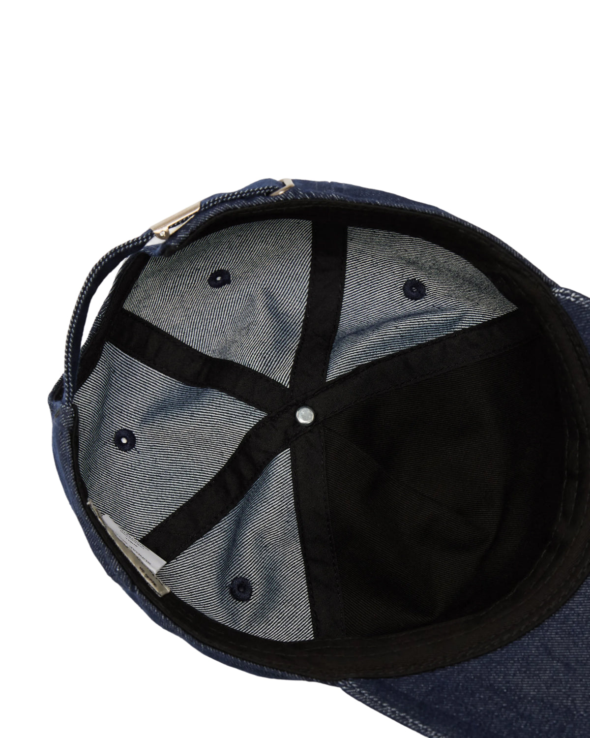 The inside view of the TIGER DEN CAP by Sundae School reveals stitched panels, a metal button at the top center, ventilation eyelets, and a black interior sweatband—all crafted from a premium cotton blend for lasting comfort.