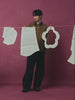 A MALE MODEL PUTTING ON A SUNGLASSES WEARING SUNDAE SCHOOL TAN KNOT BARN JACKET