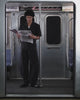 A young person with curly hair and glasses wears the BLACK HANBOK LINEN SHIRT by Sundae School in a subway car, standing beneath a 117 Hester St sign with a subway map beside it.